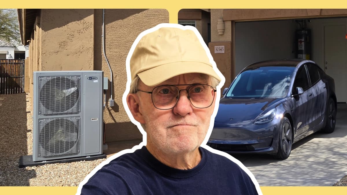 Garth, in a beige cap, stands by his heat pump outside his house, with his EV parked in the garage.