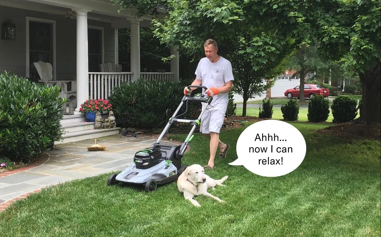 Bob mows his lawn with an electric lawn mower with his dog Annie lying down in the grass. The speech bubble to the right of Annie says "Ahhh...now I can relax!"