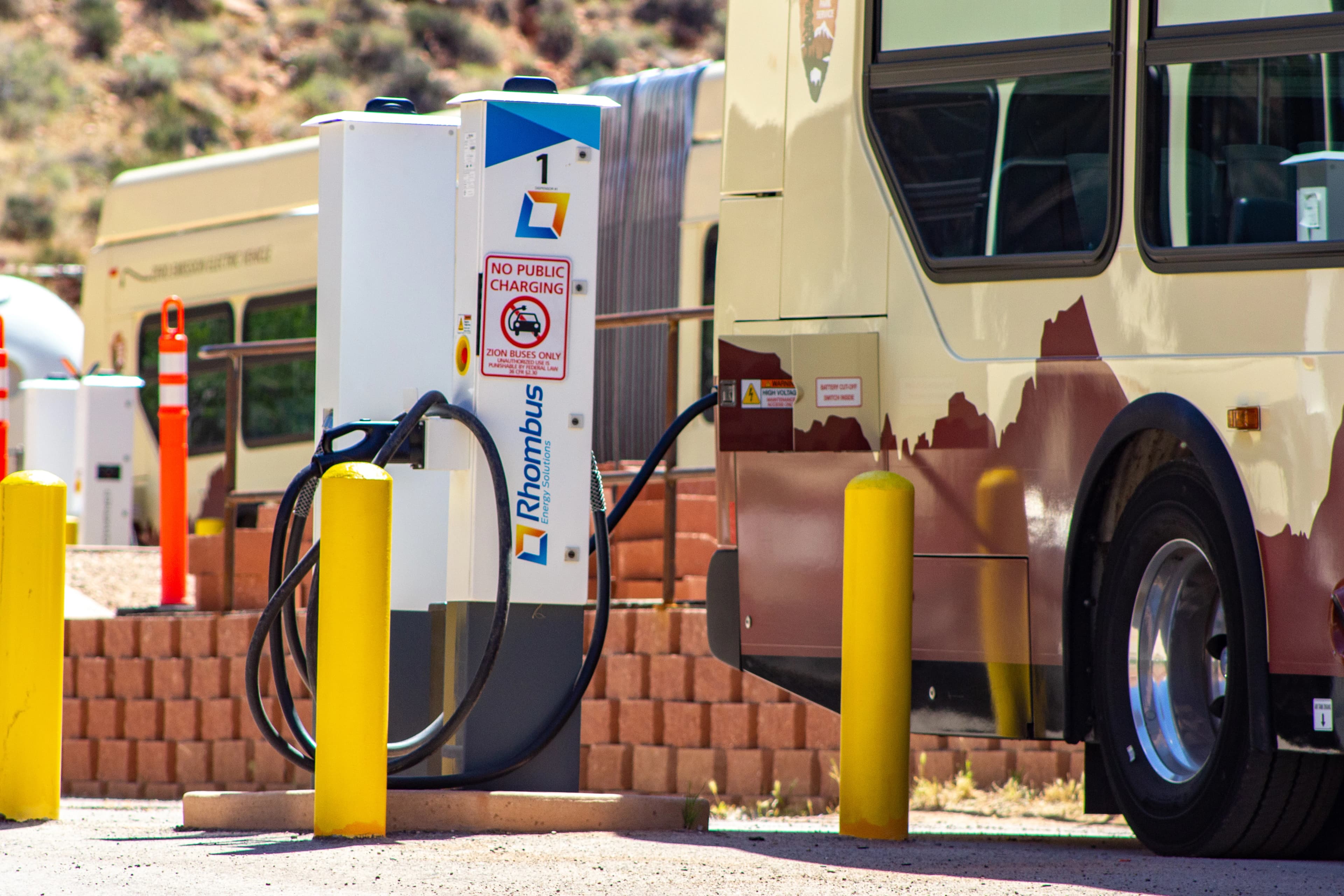 Electric shuttle charging at a station.