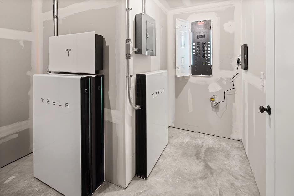 Photo of Tesla battery for charging electric vehicle in garage